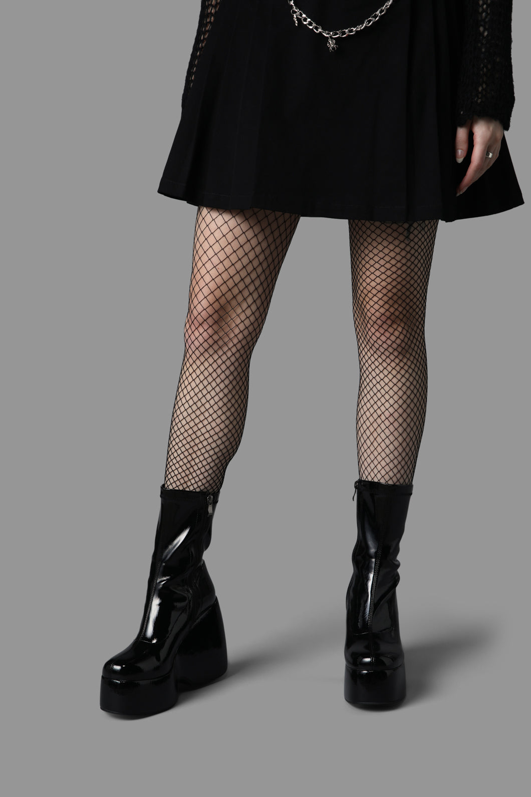 Black Skirt and Fishnet Tights